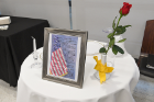 This America's White Table is a symbolic tribute to missing veterans. It is set for one to symbolize that some are missing from the ranks.