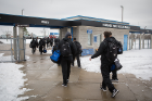 The players head out of UB Stadium to board a bus to the airport.