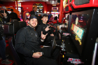 Safeties Nick Gallo (left) and Owen Chambers pause to flash a "horns up" while playing a video game in the arcade. 