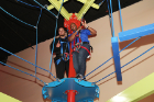 Outside linebacker Will Terry (left) and defensive tackles coach Tim Edwards try out a ropes course before bowling.