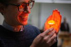 Timothy Cook, assistant professor of chemistry, served as a judge in the competition. "I'm a photochemist," he said. All things are made better with light." Photo: Douglas Levere