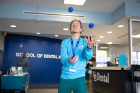 Robert Brown juggles for young patients' amusement.