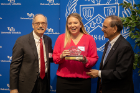 Andrea Proper, department manager in the School of Nursing, accepts the William R. Greiner Award, given to an individual who demonstrates the passion that the late UB president had for the campaign. With Proper are campaign chair Joseph Zambon (left) and President Satish K. Tripathi.