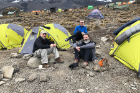 From left: John Sexton, Scott Weber and John Reese sit near their tents at Karanga Camp, elevation 13,000 feet.