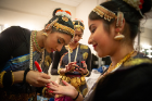 Indian SA performers prepare for their performance backstage.