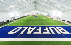 The fieldhouse features a synthetic turf infill system with full football field striping and end zones.