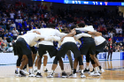 The men's basketball team huddles before its second-round game against Texas Tech. Photo: Dave Crenshaw