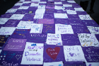 Sentiments of support decorate a commemorative quilt.