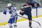 UB sophomore Cameron Leber (left) collides with an RIT player.