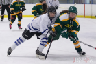 UB's Megan McCluskey (left) fights for the puck with an Oswego player.