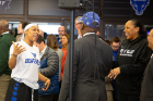 Women's basketball player Cierra Dillard (left) chats with Buffalo Mayor Byron Brown (center in blue cap) and coach Felisha Legette-Jack. Also pictured are President Satish K. Tripathi (far right) and A. Scott Weber, vice president for student life (behind Brown). Photo: Meredith Forrest Kulwicki