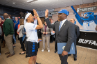 Cierra Dillard shares a high-five with Buffalo Mayor Byron Brown. Photo: Paul Hokanson