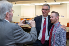 Nursing student Kyle Townsend poses for a photo with A. Scott Weber, vice president for student life.