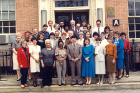 Faculty and staff from the Department of Social and Preventive Medicine, then part of the UB medical school, gather outside their offices at 2211 Main St. near Sisters Hospital, in approximately 1989.