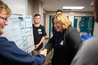 Jean Wactawski-Wende, dean of the School of Public Health and Health Professions, shakes hands with participants in the inaugural statistics competition. Photo: Douglas Levere
