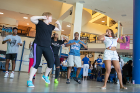 Bonnie Elinski, an instructor with Recreation and Intramural Services (at left in blue sneakers), kicks off the fun with some energetic zumba.