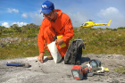 Caleb Walcott collects a sample. Chemical analysis of such specimens can help pinpoint when glaciers receded from a region. While geologists analyze rocks, Charlotte Lindqvist will lead efforts to analyze DNA preserved in the fossil bones of animals that lived in the region long ago. These analyses will provide insight into whether southeast Alaska could have served as an Ice Age refuge for plant and animal life.