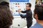Meng-Lun Lee, a member of the Control and Automation Laboratory in the School of Engineering and Applied Sciences, explains his research during the poster presentation session.