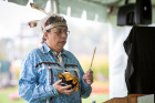 A member of the Tuscarora Nation plays a drum before the designation ceremony.