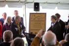Tuscarora Nation Chief Leo Henry (left) and Jajean Rose Burney (right), deputy executive director of the Western New York Land Conservancy and the U.S. co-chair of the binational Niagara River Corridor Ramsar Site Steering Committee, unveil the plaque designating the Niagara River Corridor as a Wetland of International Importance.