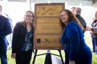 UB Law alumna Bridget Steele (left) and Kim Diana Connolly, vice dean for advocacy and experiential education, and director of clinical legal education, pose with the designation plaque. UB law students invested more than 1,450 pro bono hours to perform the legal and policy work required for the Ramsar designation.