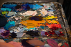 An artist's palette is awash in color.