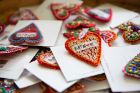 Buffalo supporters share the “Buffalove” with these one-of-a-kind heart pins, hand-embroidered by the refugee women at Stitch Buffalo. These pins have also become popular with residents of the Buffalo Bayou region of Texas.