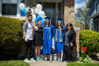 Graduates Alexa Federice (center right) and Jaycee Miller (center) pose with (from far left) Alexa's brother Josh Federice, sister Melissa Field and mom Emilie Federice for a portrait outside their house in University Heights. Photo: Douglas Levere