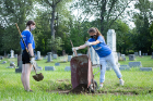 Students began the days of service on Aug. 24 at Concordia Cemetery, an historic cemetery on the East Side of Buffalo. Anya Wansha (left) waits, ready to spread out the dirt that Savanna Falsone dumps from her wheelbarrow. Both are first-year students. Photo: Meredith Forrest Kulwicki