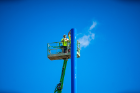A blue support pole mimics a bright blue sky. Photo: Douglas Levere