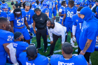 UB assistant coaches give players direction during a break in the action. Photo: Douglas Levere