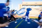 Victor E. Bull leads the charge out onto the field at UB Stadium. Photo: Meredith Forrest Kulwicki