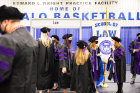 Law school graduates gather before the ceremony in the Edward L. Wright Practice Facility. Photo: Meredith Forrest Kulwicki