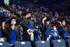 Graduates turn their tassels. Photo: Meredith Forrest Kulwicki