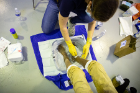 The students gently cleanse the feet and if there are any concerns, such as infection, they contact one of the physicians, who performs an exam and provides treatment as needed.