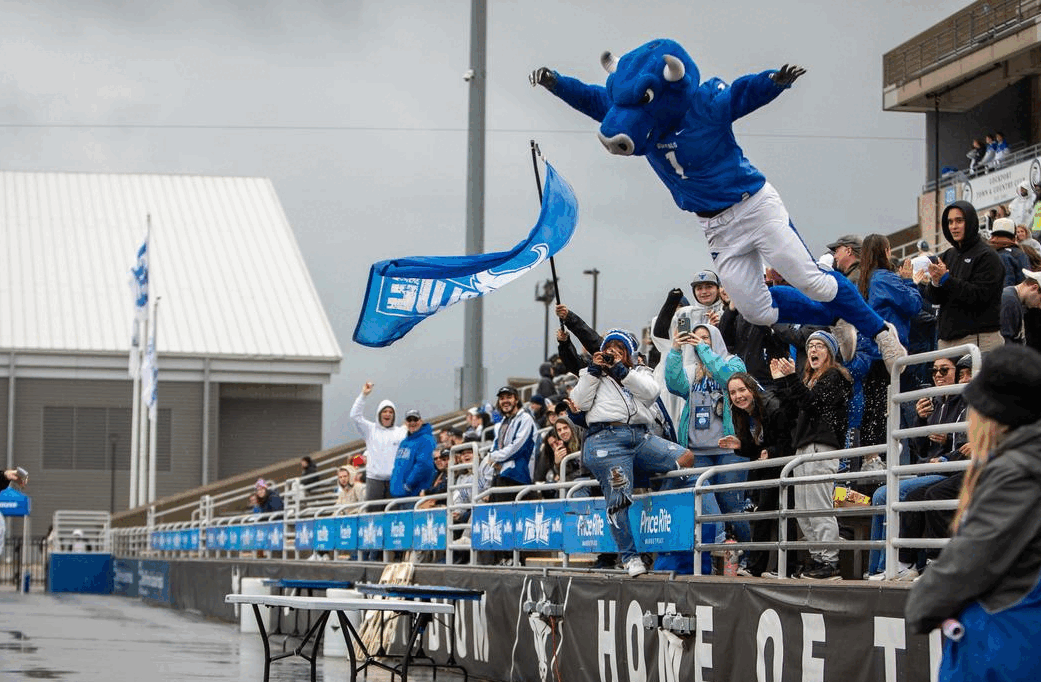 UB mascot Victor E. Bull smashes a folding table during the homecoming game.