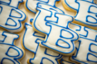 A tradition. Each cookie is hand-cut with a special “UB logo” cutter and individually iced and hand-piped with white and “UB Blue” frosting.