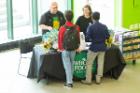 Students talking at a sponsor table in the Union