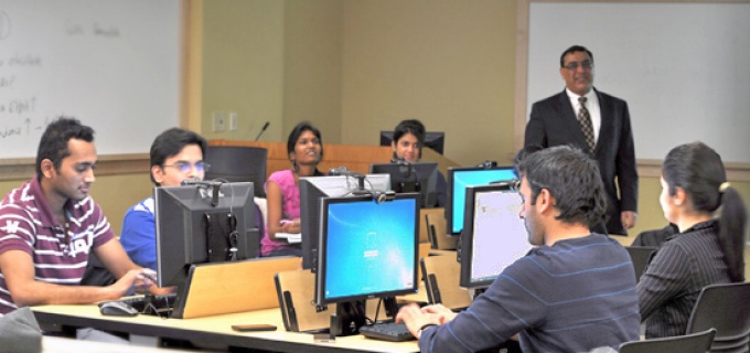 Student picks up printer output at computing site.