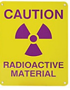 Example of a Caution - Radioactive Material sign displaying a radiation symbol. 