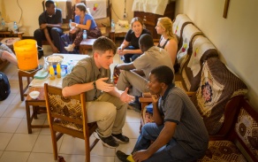 Student talking with community partner in Tanzania. 