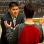A faculty member talking to a student. 