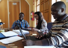 Zoom image: Nadia with data managers, Tafadzwa and Wellington. &quot;They were teaching me how to enter data in the system, how to identify and fix errors, and what the different codes meant.&quot; 