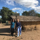 Korinne and Jennifer next to a wound care site. 
