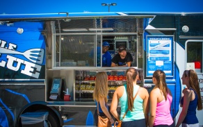 Students working in a food truck on campus. 