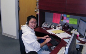 Student working in an office on campus. 