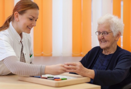 Nurse working with older woman. 