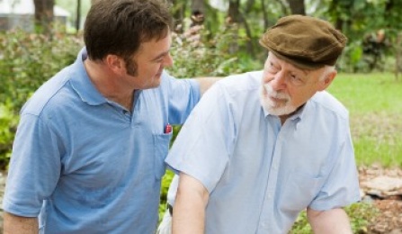 Photo of Young Man with arm on the shoulder of older man. 