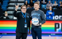 Kelly Cruttenden and Ben Fabian from the LGBTQ FSA on the court at Alumni Arena. 