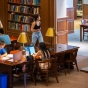 Students in the library studying. 